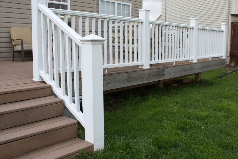 A raised deck with railings